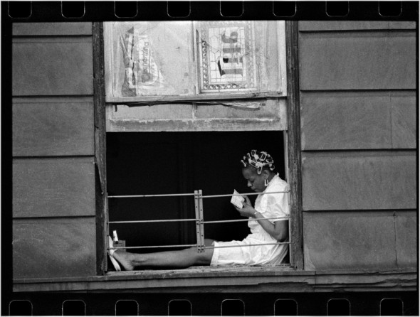 girl in Harlem window