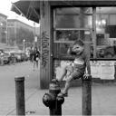 Kid Waving from Hydrant Harlem